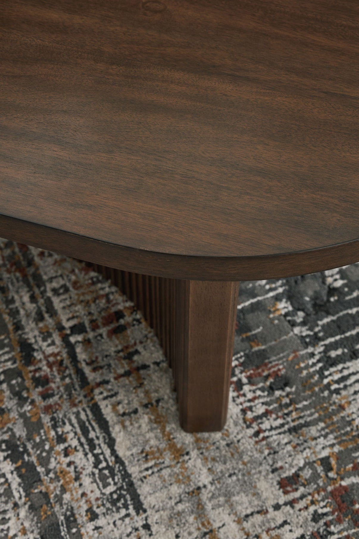 Korestone - Oval Cocktail Table - Dark Brown, alternate view 4 with wood construction
