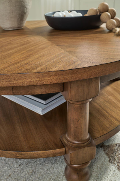 Chadworth - Round Cocktail Table - Medium Brown